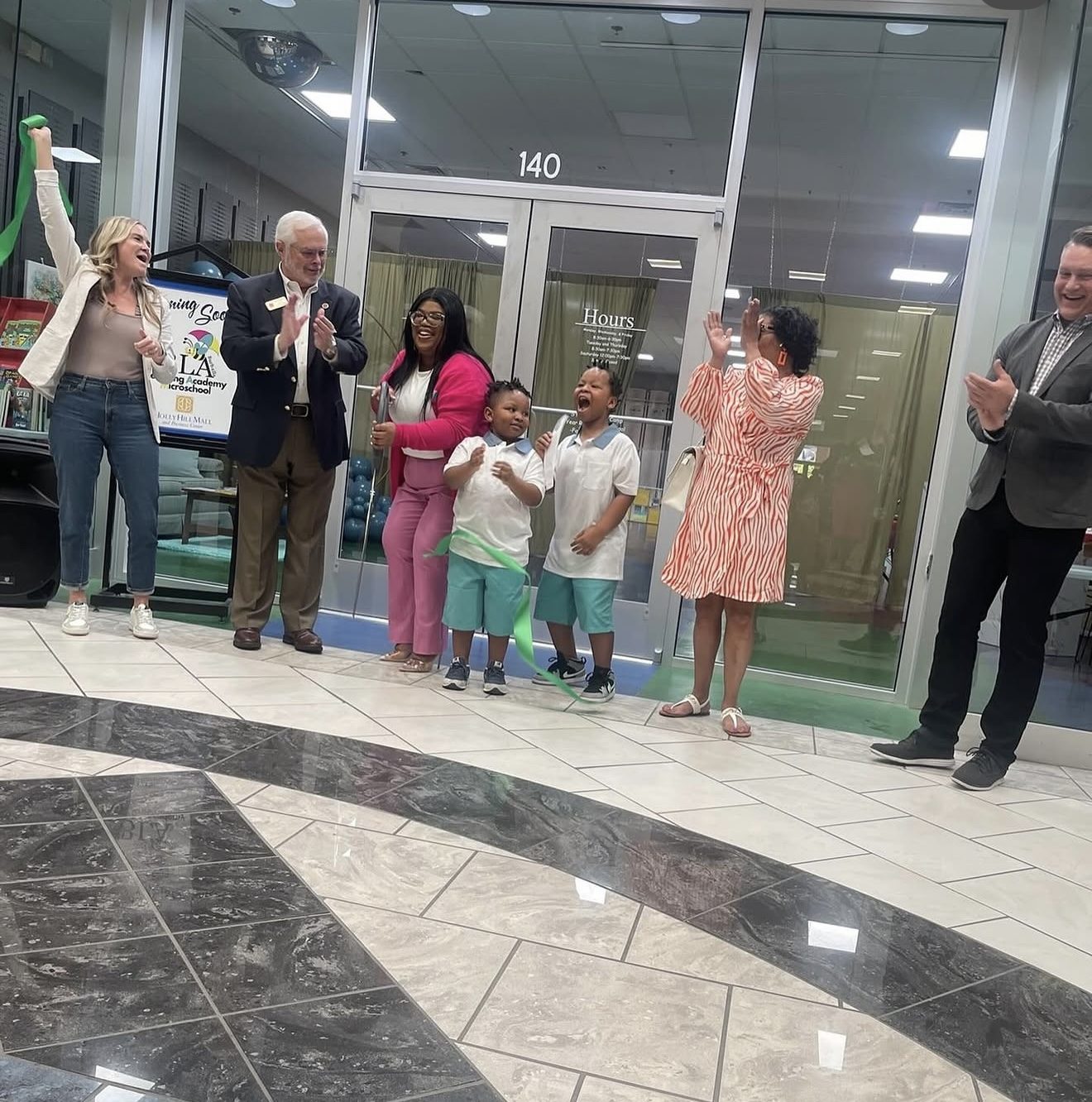 Dominque Burgess at the ribbon-cutting ceremony for Burbrella Learning Academy