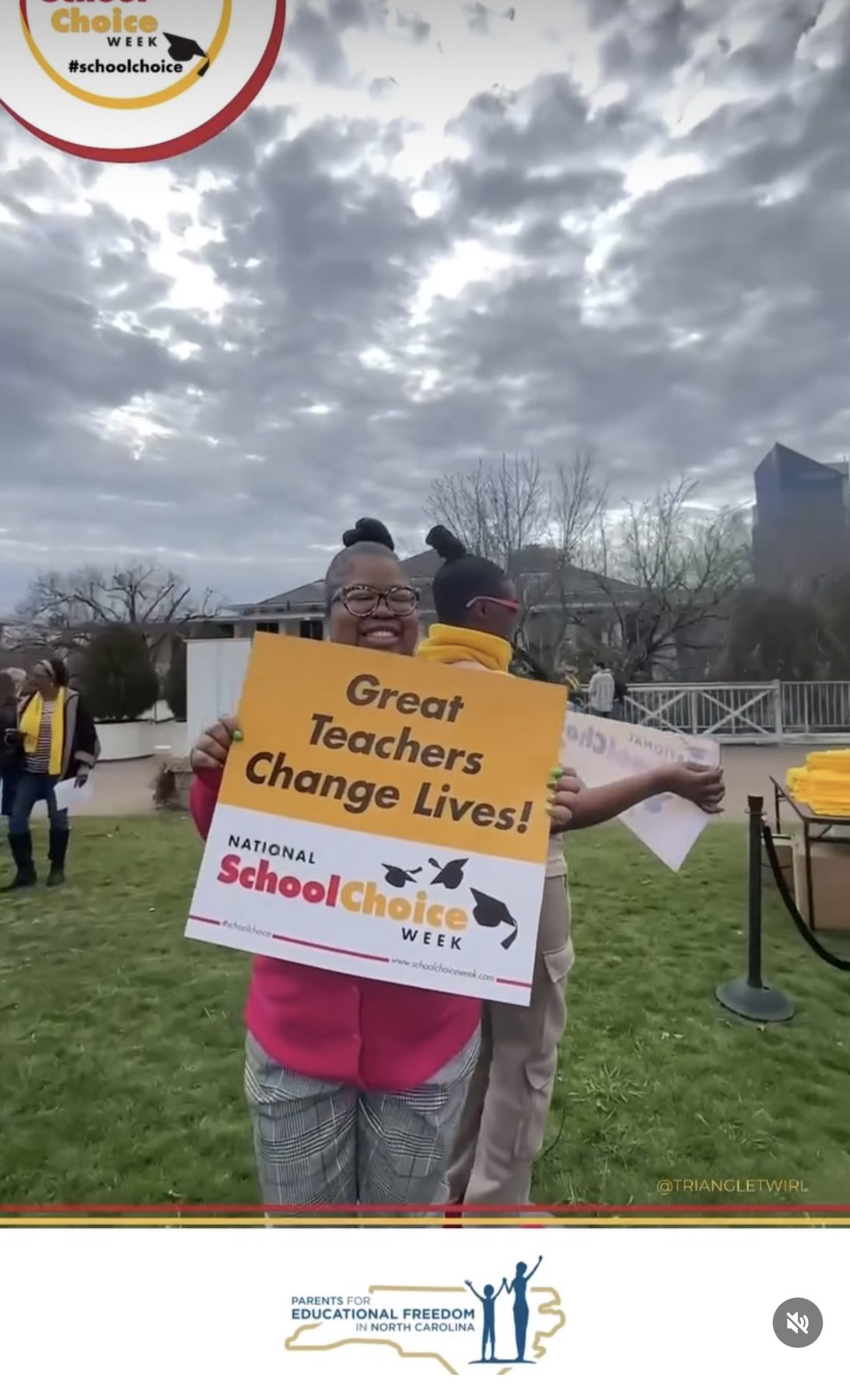 Dominque Burgess at a National School Choice Week rally holding a sign that reads Great Teachers Change Lives